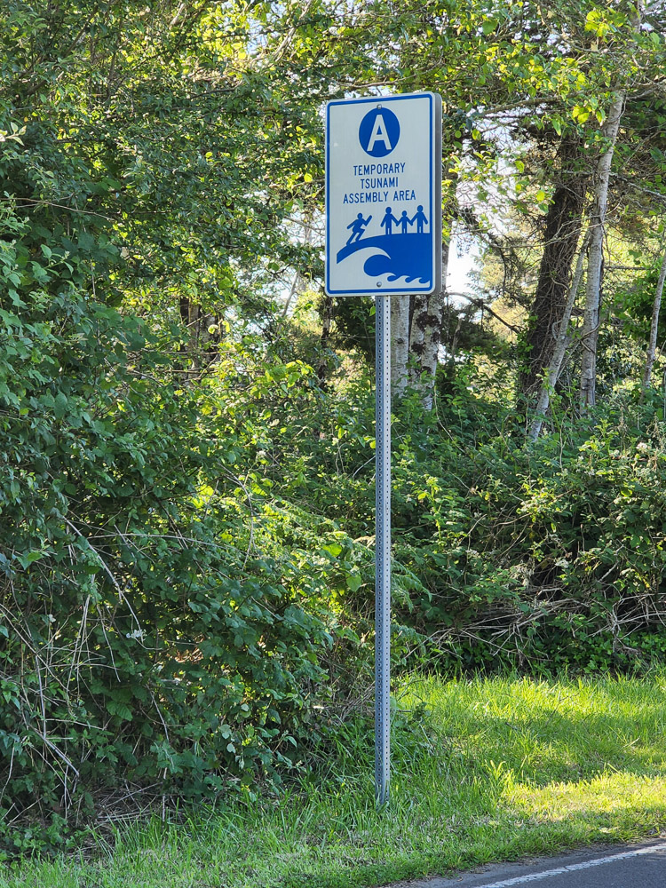 a road sign designating a Tsunami assembly area along the Oregon coast