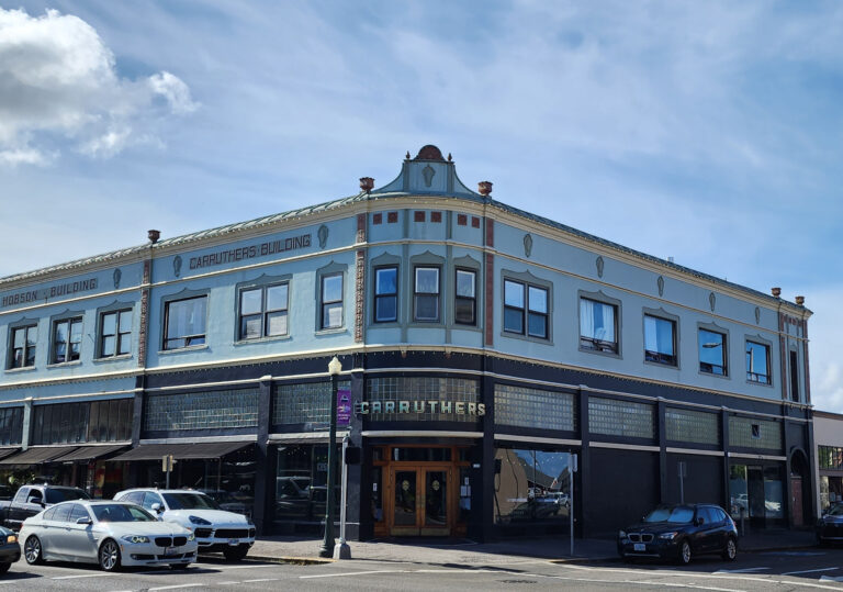 exterior of an aqua blue art deco-style restaurant building in Astoria, Oregon