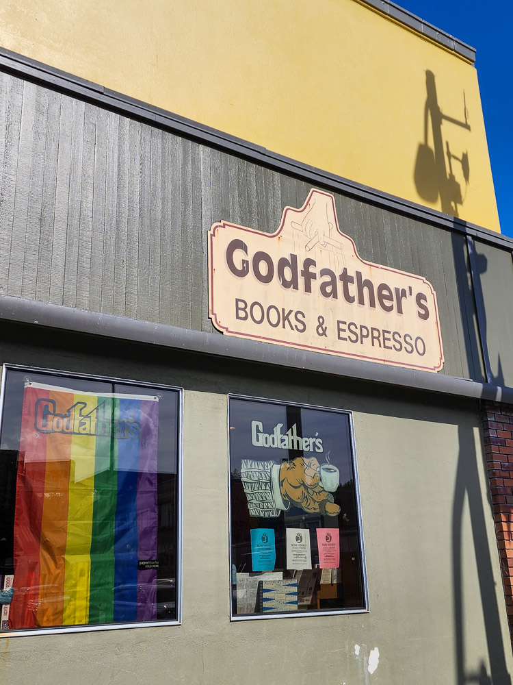 a bookstore with a pride flag, view from the street in Astoria, Oregon