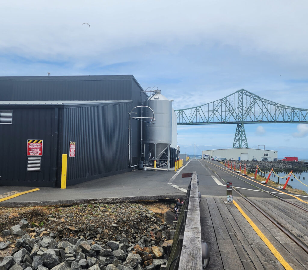 the riverfront running and cycling path in Astoria, Oregon, next to a brewery