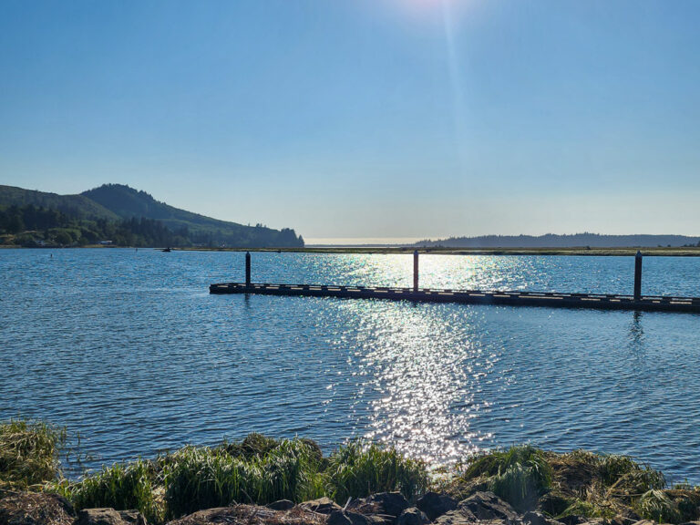 sun reflecting on the Nehalem River in Wheeler, Oregon